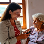 **Prompt 1: The Digital Transformation of an Elderly Learner in Portugal**
    "A heartwarming scene featuring a compassionate female educator in her 40s, patiently guiding an elderly Portuguese woman, 70s-80s, on a smartphone. The woman's face beams with profound joy and a sense of rediscovered connection, symbolizing restored dignity. Soft, digital light rays or subtle network lines emanate from the phone, hinting at communication with distant family. The setting is a cozy, brightly lit room that suggests a traditional Portuguese interior, perhaps with a glimpse of a rural village through a window. Emphasize the empowerment and the 'light igniting within' the learner through digital inclusion, creating a warm and hopeful atmosphere."